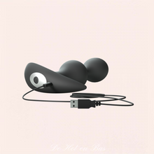 Charger l'image dans la galerie, Le plug anal vibrant en silicone liquide noir très doux est disponible sur notre site en couleur rose/prune.