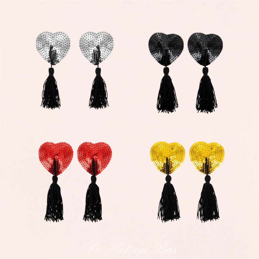 Burlesque est une collection de cache-tétons en forme de cœurs avec sequins adhésifs avec pompons noirs.