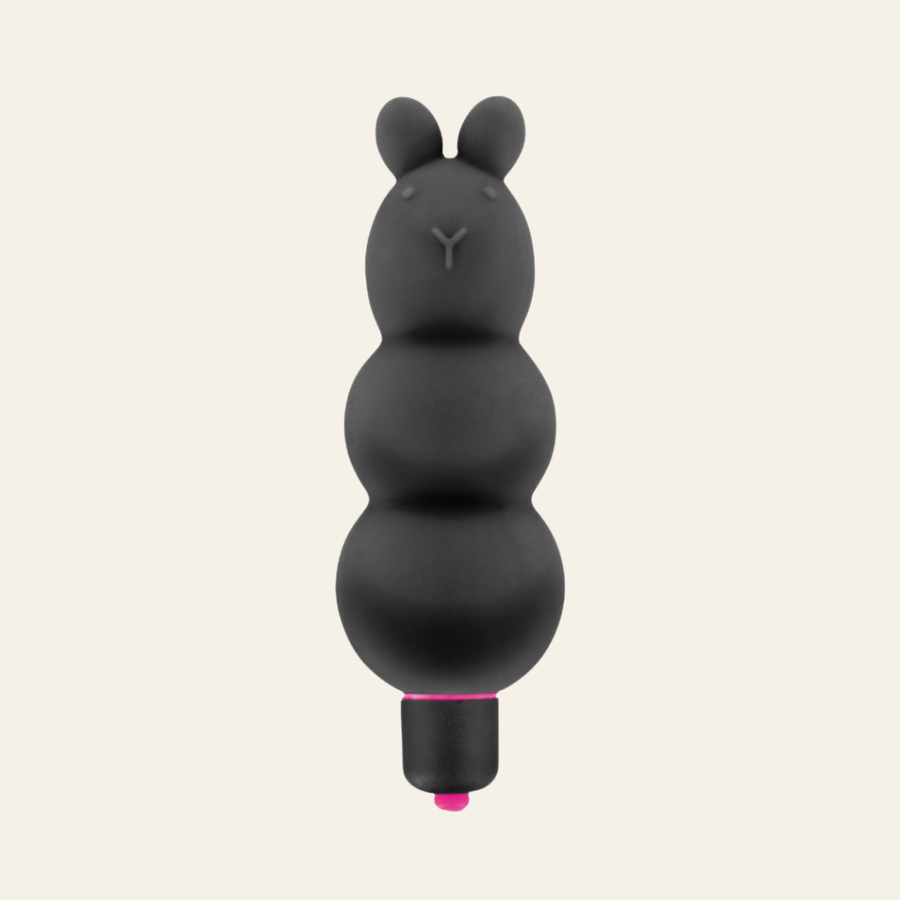 Mini vibromasseur noir et un peu de rose au niveau de la bague.