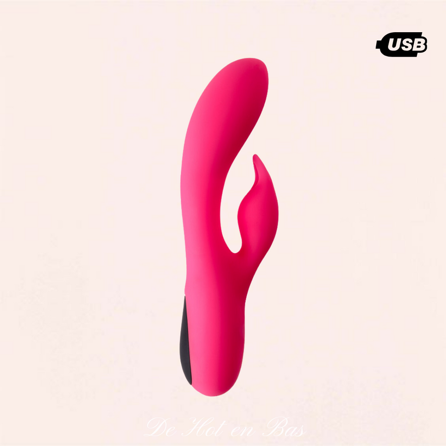 Vibromasseur rose de la marque Virgite avec un câble USB pour le rechargement du vibromasseur rabbit.