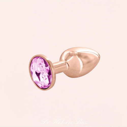 Achat plug anal doré avec un bijou cristal rose de haute qualité avec différentes tailles disponible sur notre site internet.